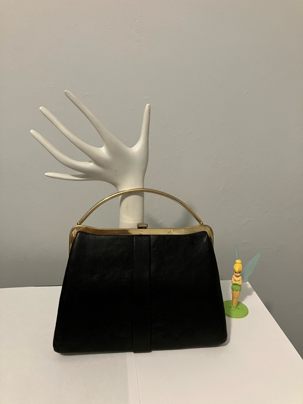 Classic Black Leather evening bag with brass trim.